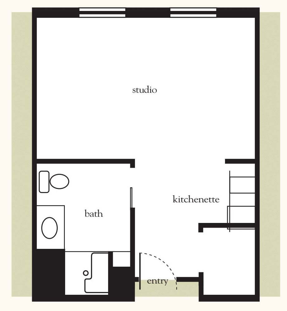 A floor plan of a studio apartment featuring a bathroom and a kitchenette.