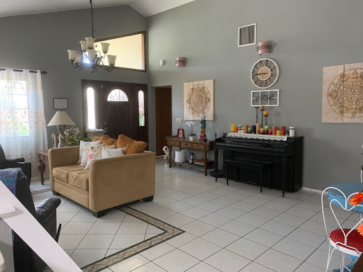 A cozy living room featuring a mix of modern and classic decor elements.