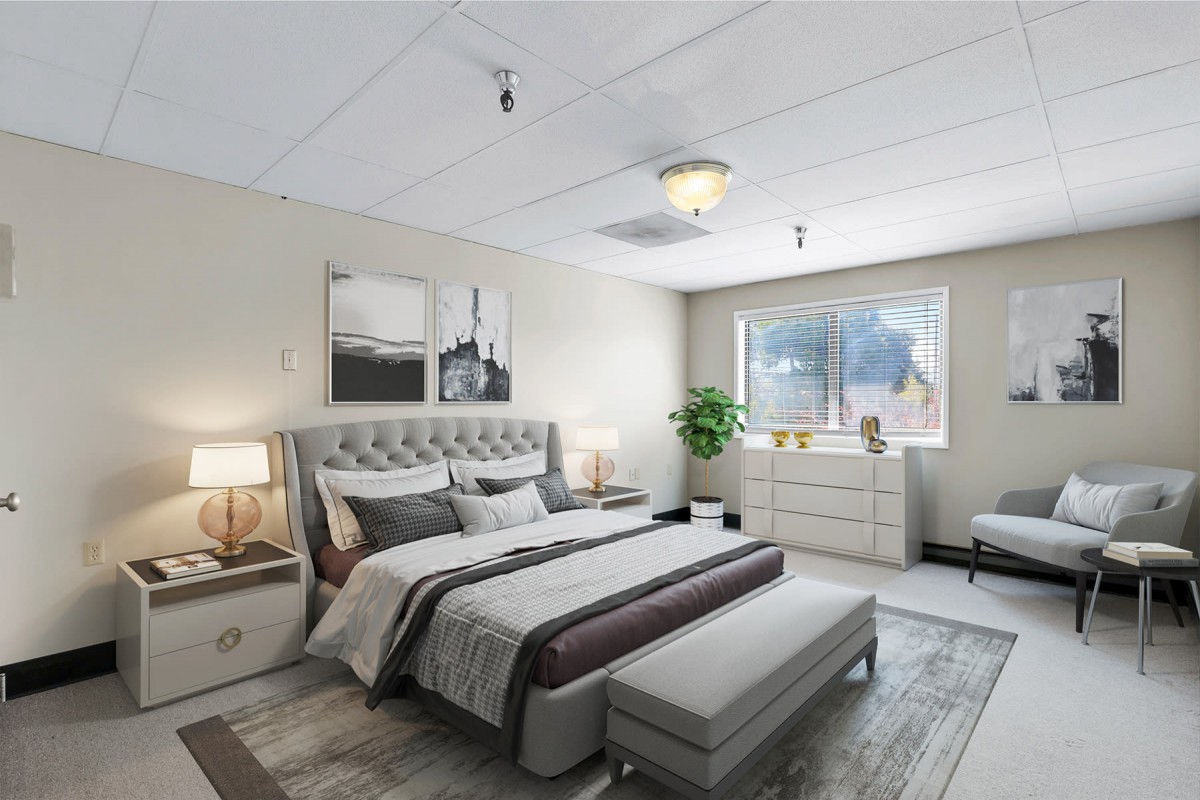 A modern bedroom interior with a plush bed, matching nightstands, and elegant decor.