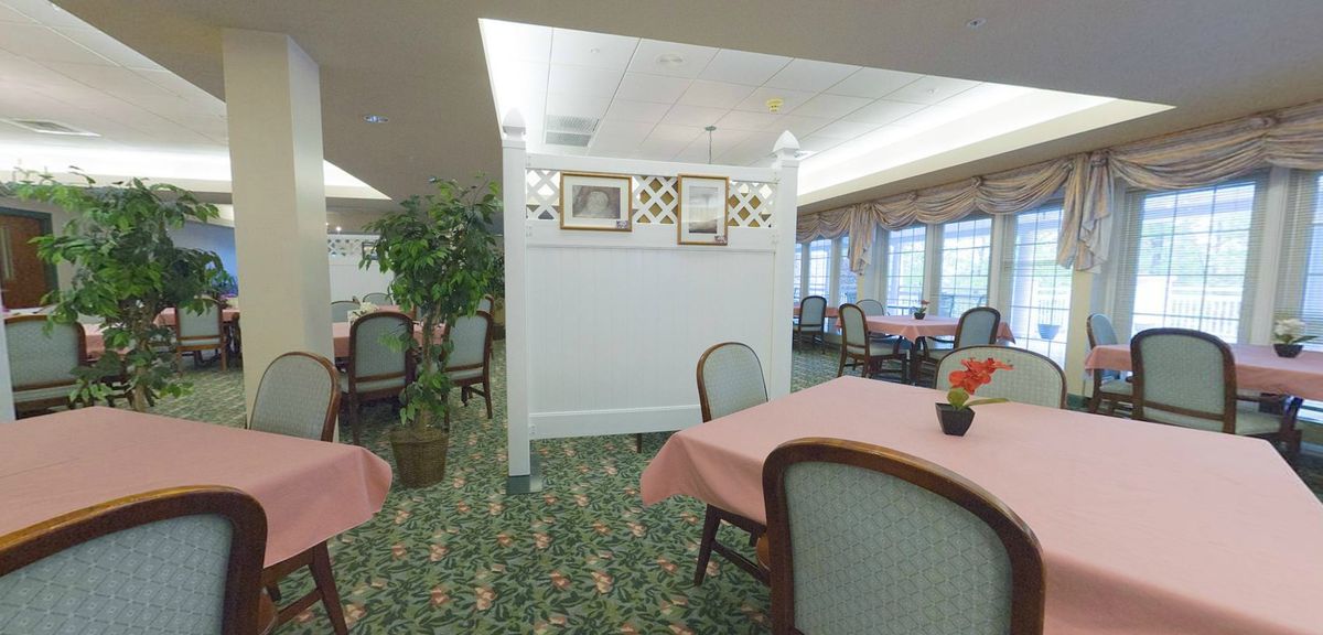 An elegantly decorated dining area with tables and chairs.