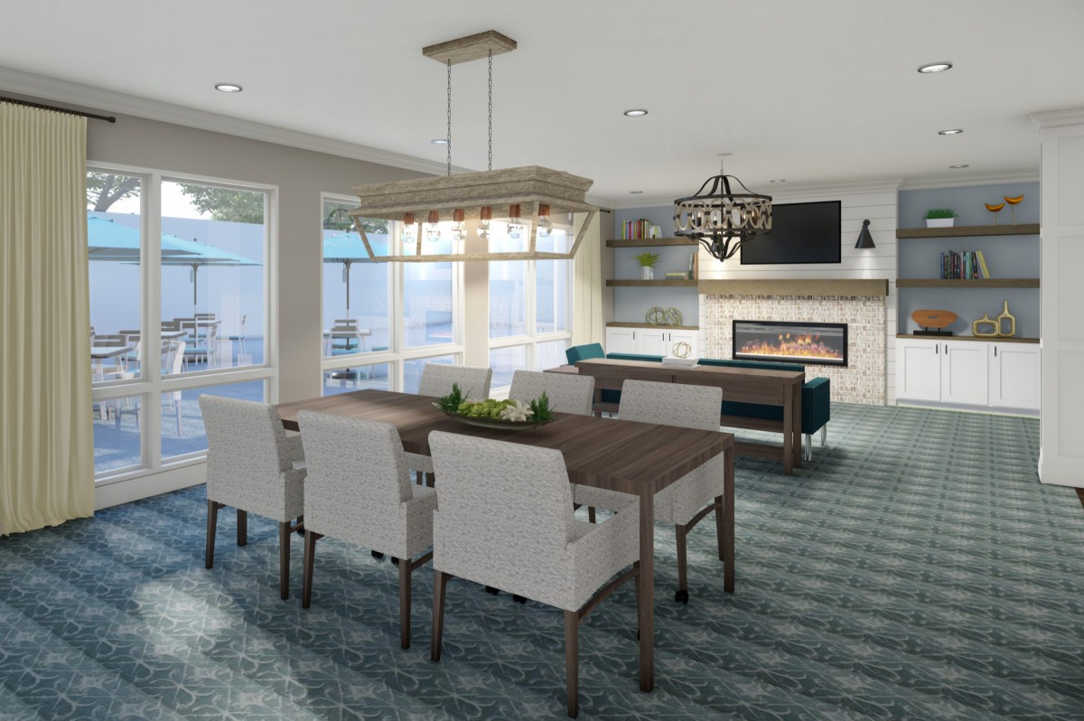 A modern and elegant open-concept dining and living space featuring stylish furniture, ample natural light, and a cozy fireplace.