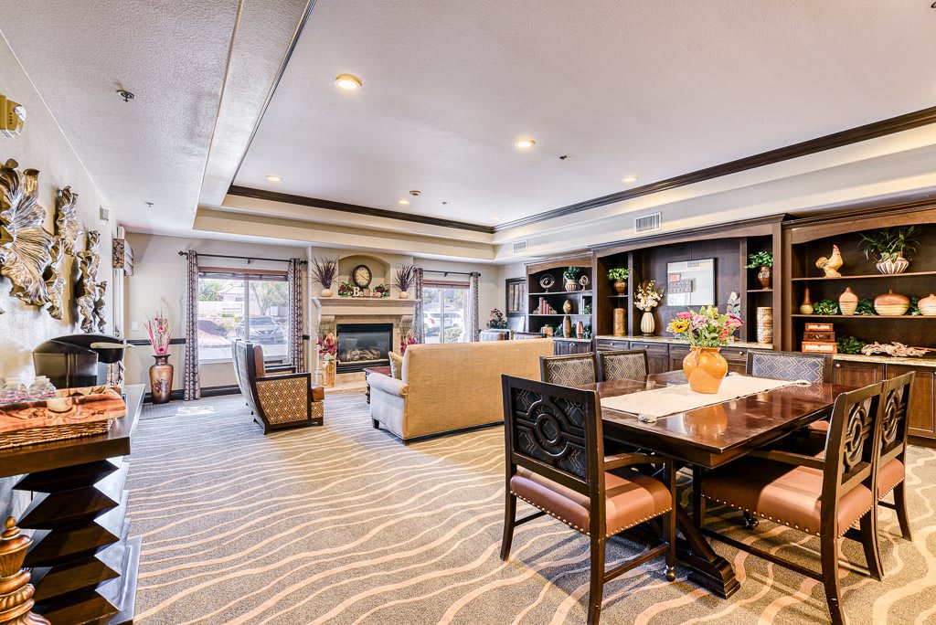 A well-decorated living room with comfortable seating and a cozy fireplace.