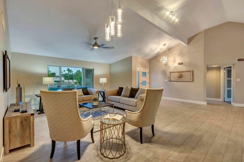 A modern living room with stylish furniture and elegant lighting.