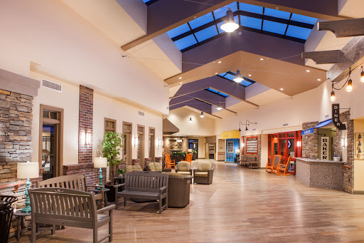 A spacious and welcoming lobby featuring modern seating and natural lighting.