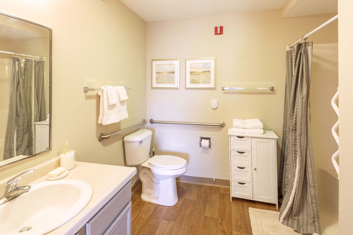A clean and well-organized bathroom with modern amenities.