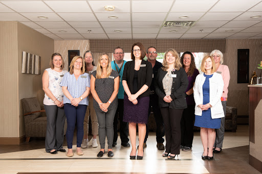 A dedicated team of healthcare professionals posing for a group photo.