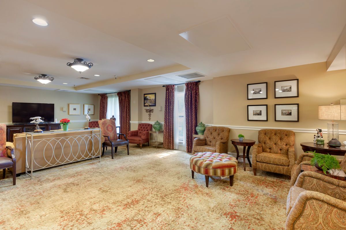 A cozy and well-furnished living area with comfortable chairs and elegant decor.