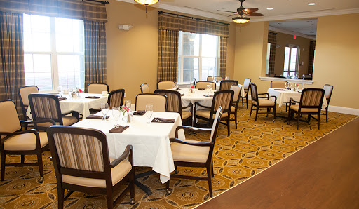 A cozy dining area with elegantly set tables, ready for guests.