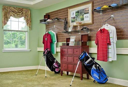 A stylishly organized golf-themed interior featuring golf attire and equipment.