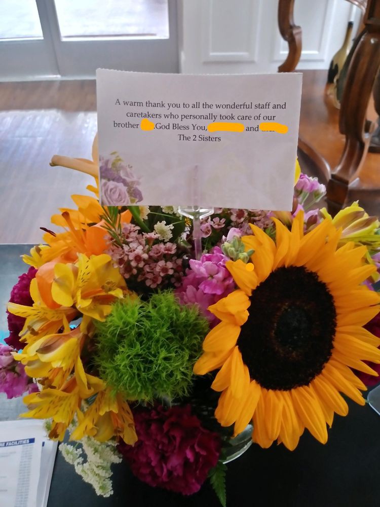 A vibrant bouquet of flowers with a card attached.