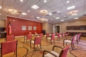 A modern conference room with arranged seating and stylish lighting.