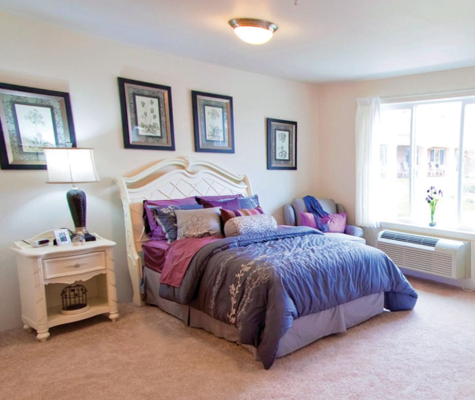 A cozy bedroom with elegant decor and a comfortable bed.