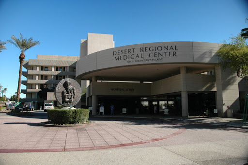 A view of the main entrance to a regional medical center featuring a sculpture.