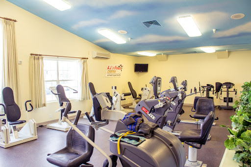 A well-equipped gym featuring various cardio machines for fitness enthusiasts.