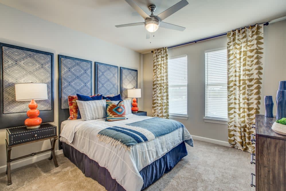 A cozy bedroom with stylish decor and a comfortable bed.