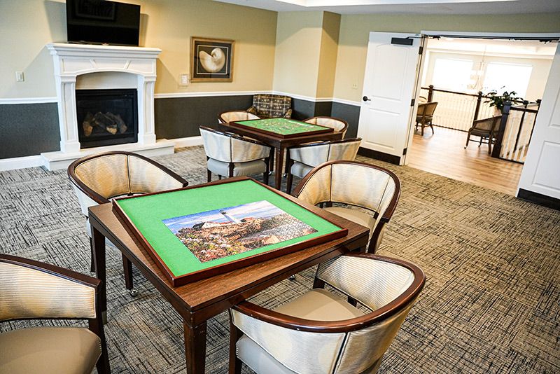 A cozy game room with tables set up for puzzle assembly.