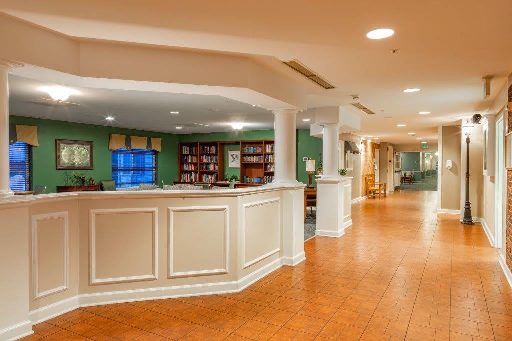A welcoming reception area with a desk and seating in a well-lit lobby.