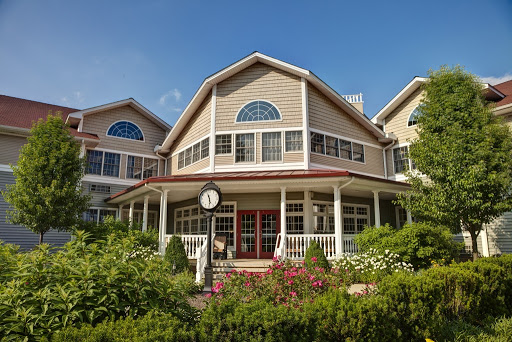 A beautiful residential building featuring elegant architecture and lush gardens.