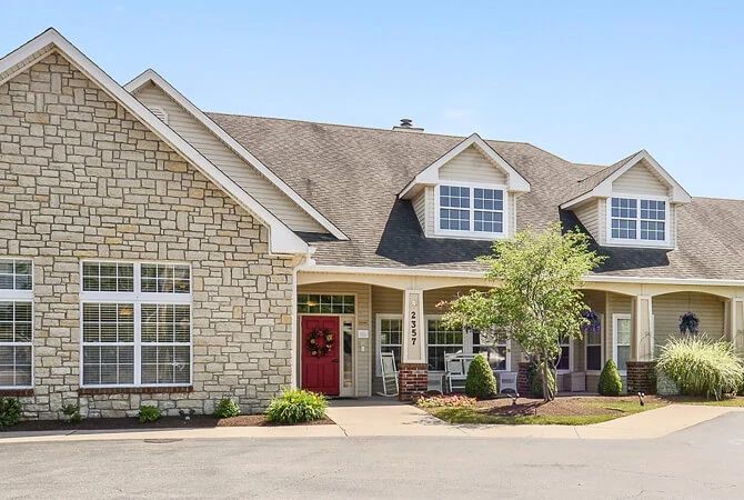 A spacious residential house with a brick exterior and well-maintained landscaping.