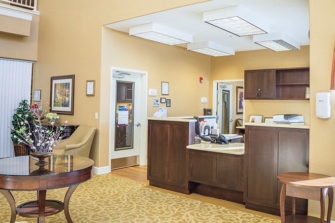 A welcoming reception area with comfortable seating and a desk.