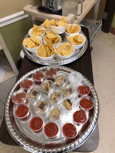 A delightful spread of chips and salsa served on decorative platters.