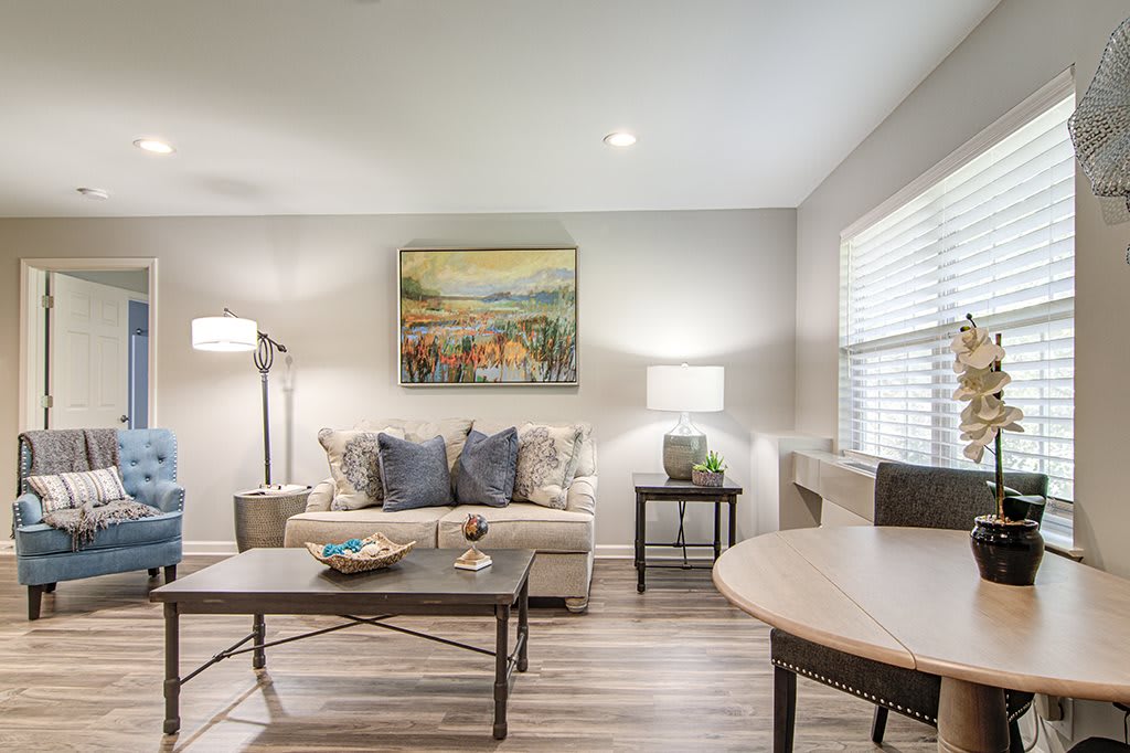 A modern living room with a comfortable sofa, stylish coffee table, and elegant lighting.