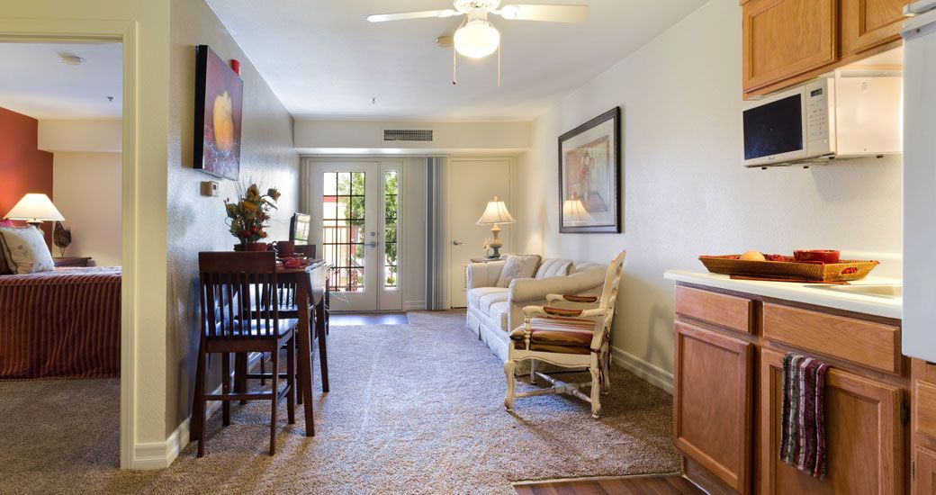 A cozy living room with comfortable furniture and warm lighting.