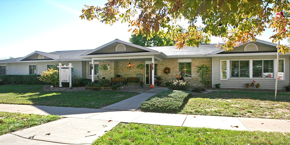 A suburban house with well-maintained landscaping and a welcoming front porch.