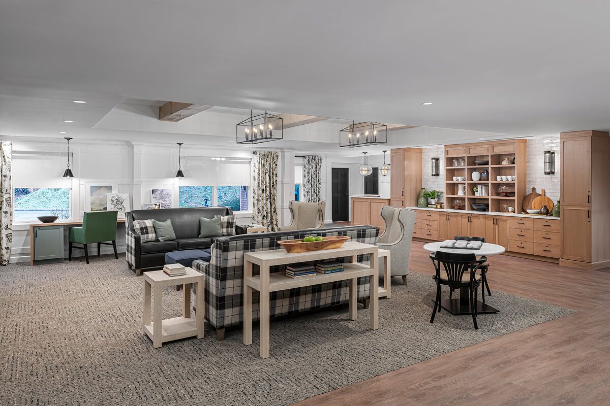 A spacious and modern living room with stylish furniture and an open layout.