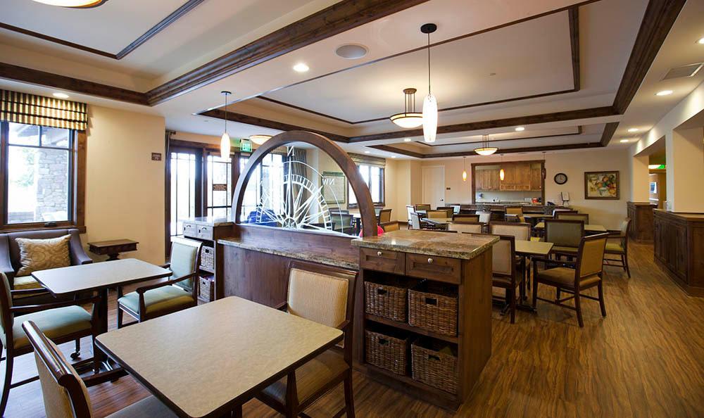 Interior view of a restaurant dining area with tables and chairs.