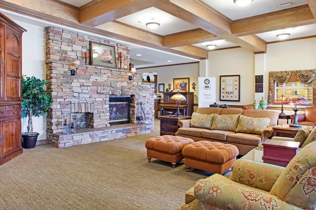 Cozy living room with a stone fireplace and comfortable seating.