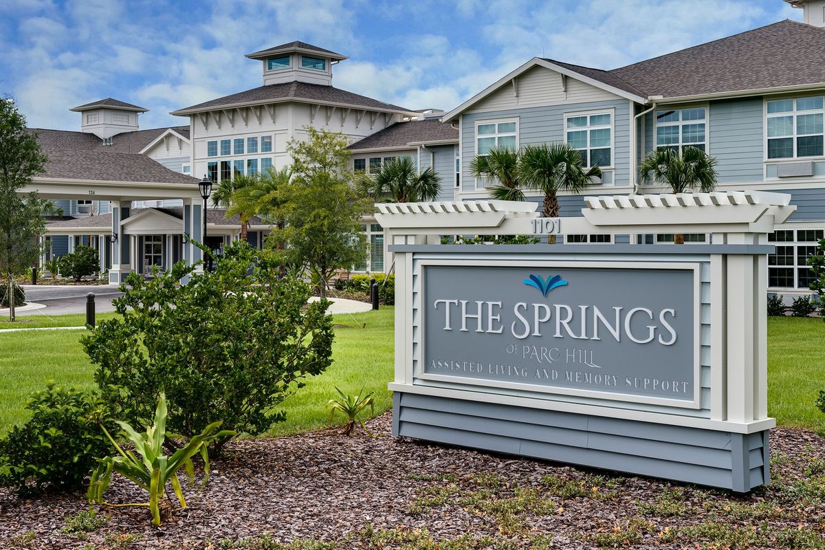 The Springs, a residential building with well-maintained landscaping.