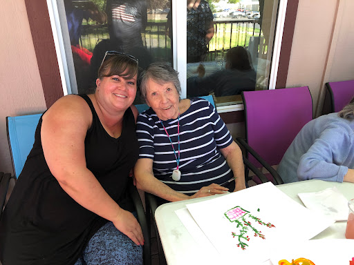 A joyful moment shared between friends enjoying a sunny day outdoors.