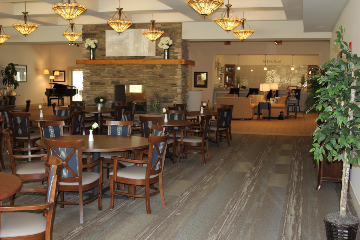 A welcoming hotel lobby with seating area and reception desk.