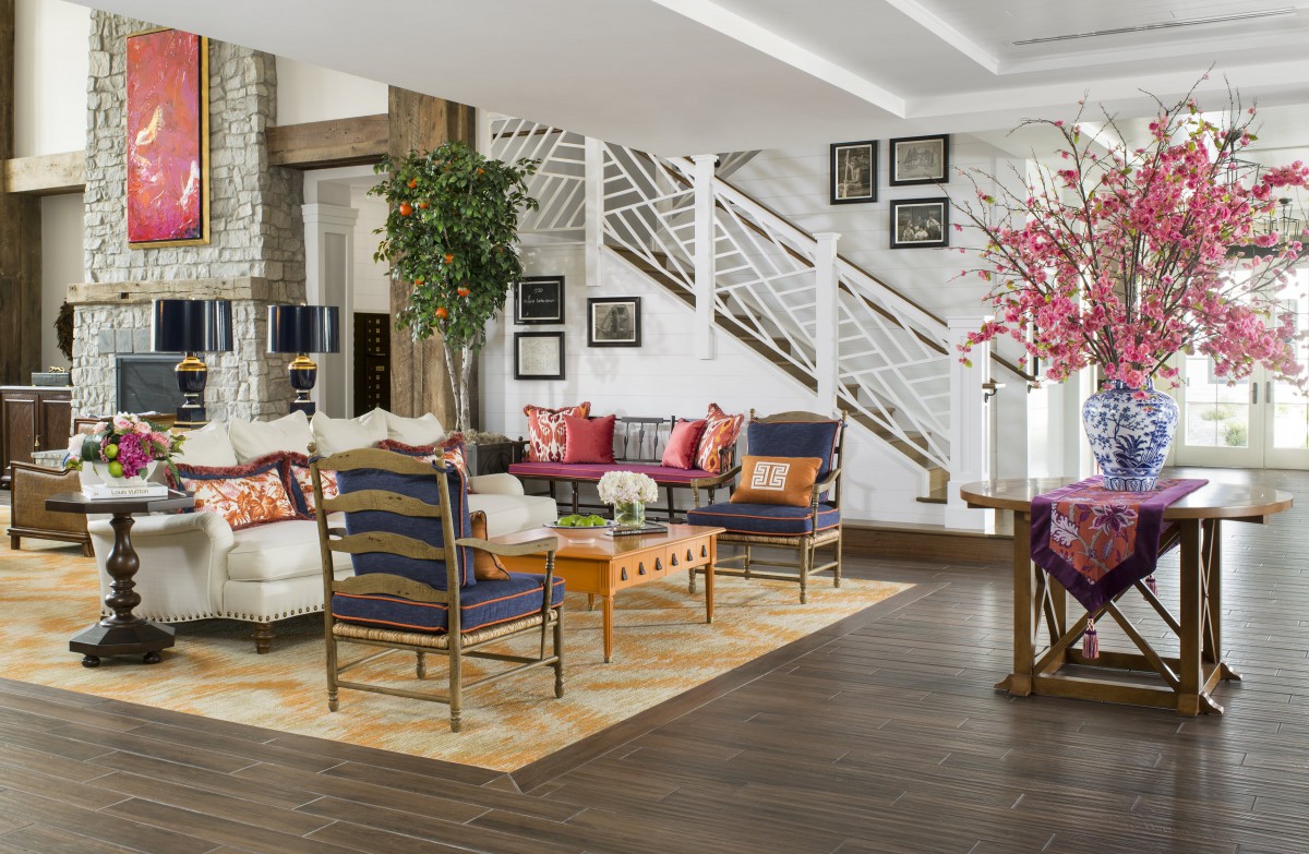 A stylish and modern living room with vibrant furniture and elegant decor.