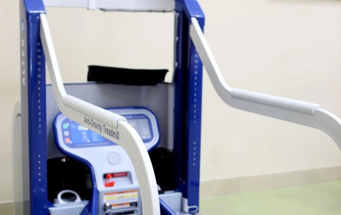 A close-up of a rehabilitation or fitness exercise machine.
