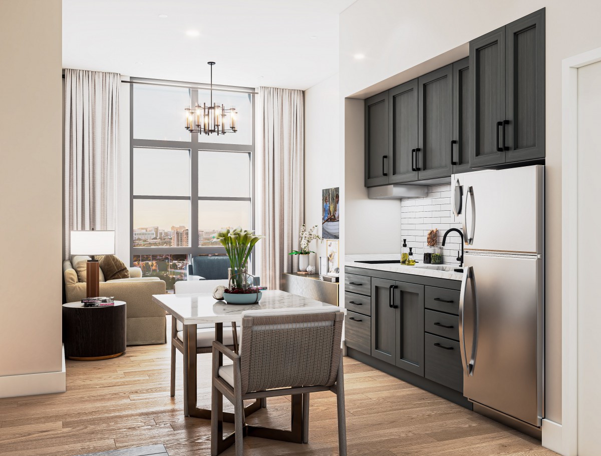 Modern kitchen and living area with natural light and elegant decor.