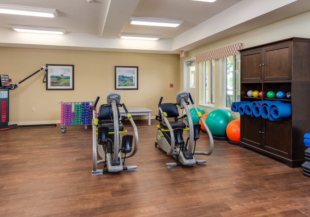 A well-equipped indoor gym with exercise machines and fitness accessories.