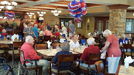 A lively community dining event with seniors enjoying their time together.