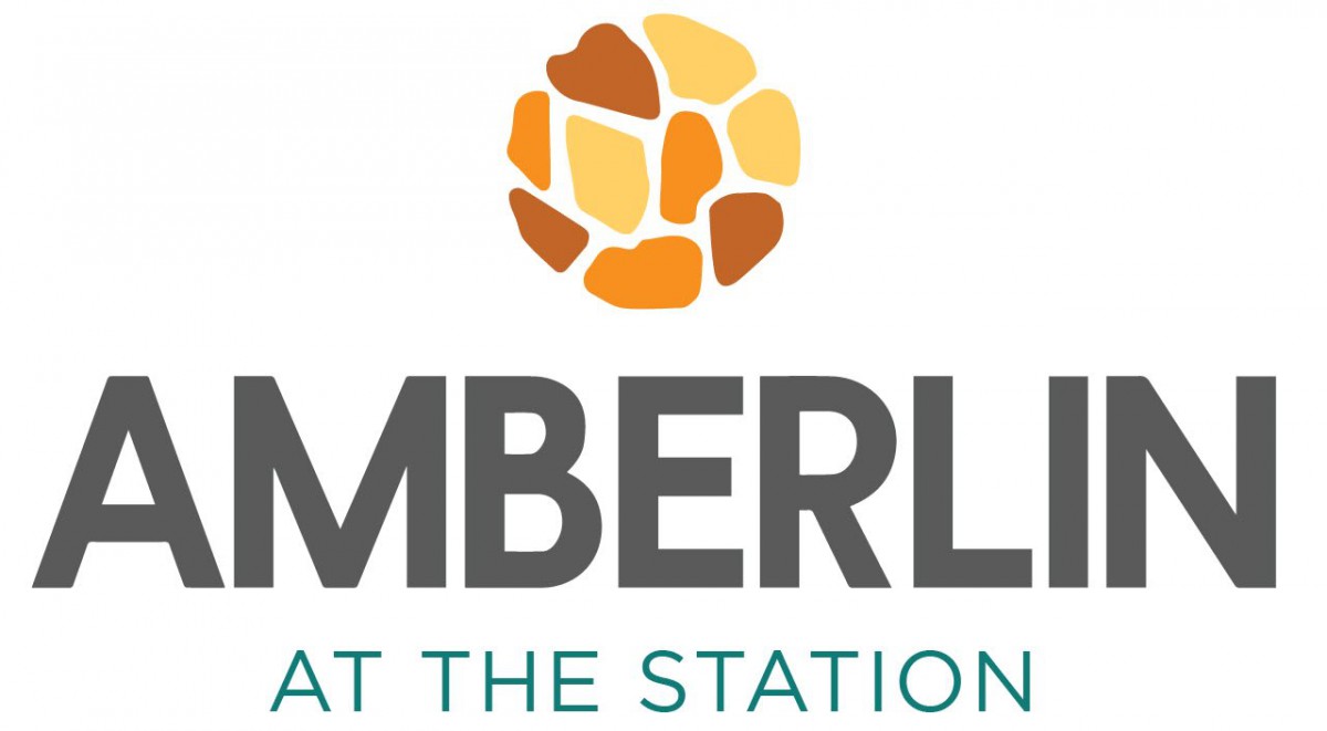 Logo featuring the text 'Emberly at the Station' with a stylized circular graphic above.