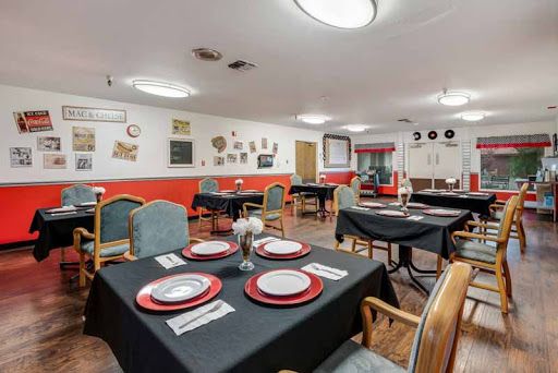 A cozy dining area set with elegant table settings and a warm ambiance.