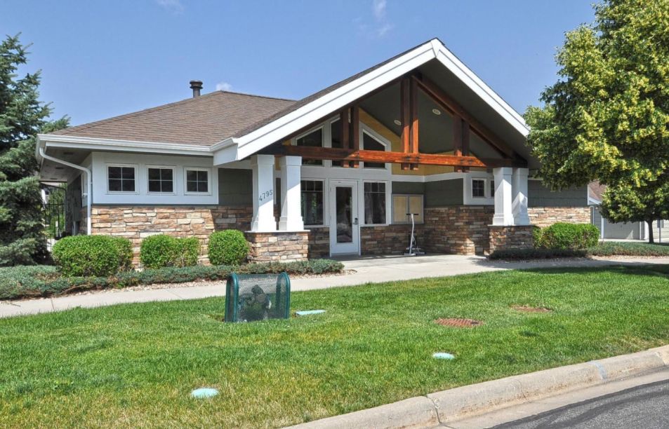 A suburban house with a well-maintained lawn and modern architectural design.