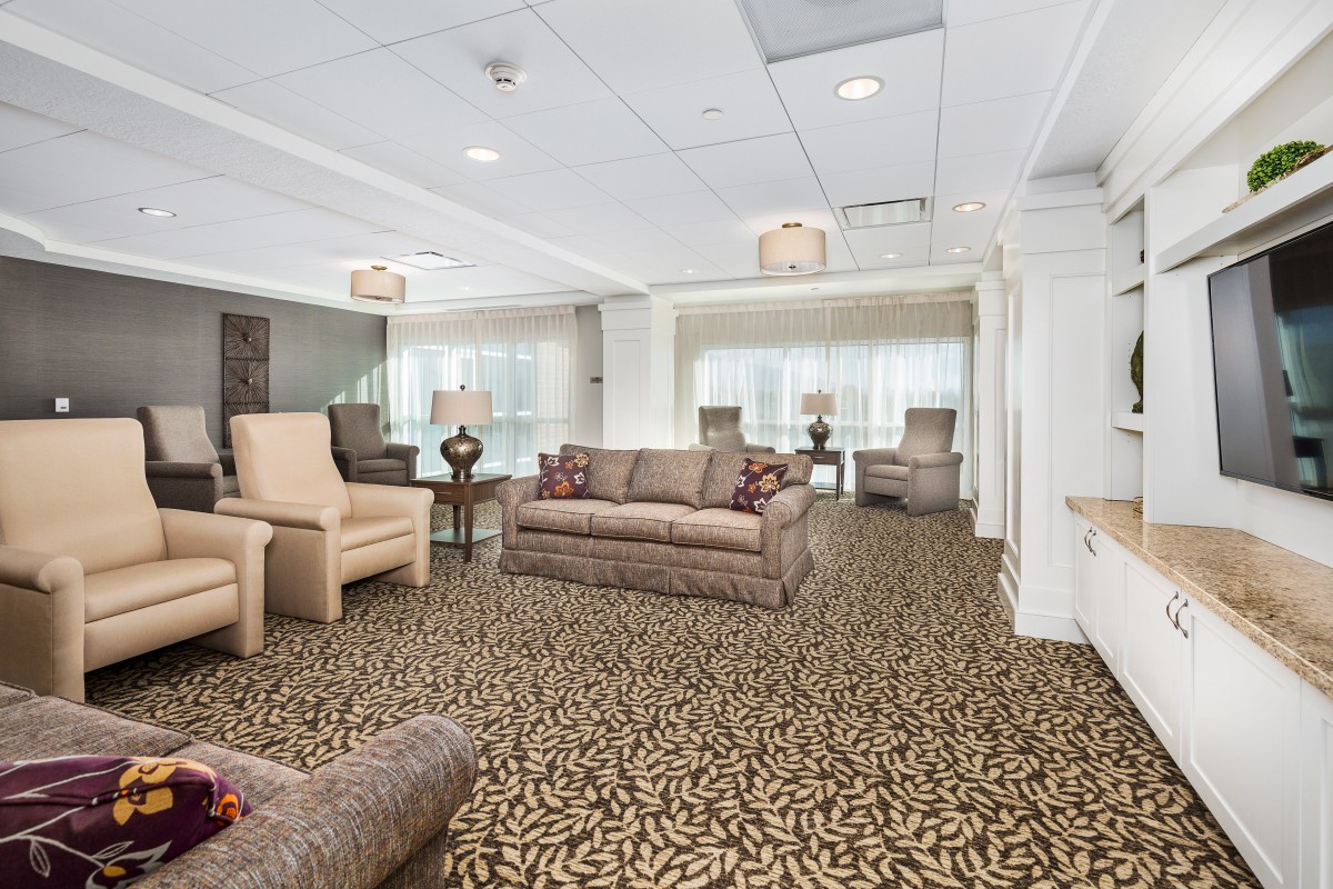 A spacious living room with comfortable seating and elegant decor.