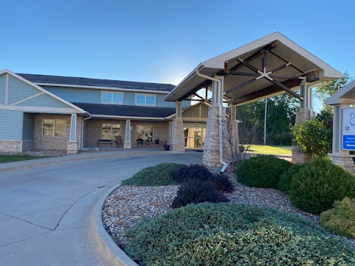 A charming residential building featuring a welcoming entrance and well-maintained landscaping.