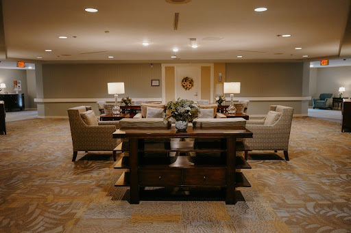 A warm and inviting living room setup featuring comfortable seating arrangements and soft lighting.