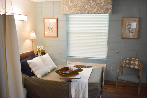 A beautifully decorated bedroom featuring a cozy bed, elegant decor, and ample natural light.