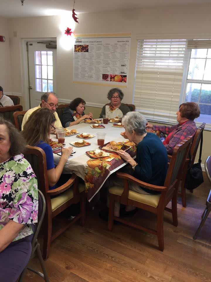 A group of people enjoying a meal together indoors.