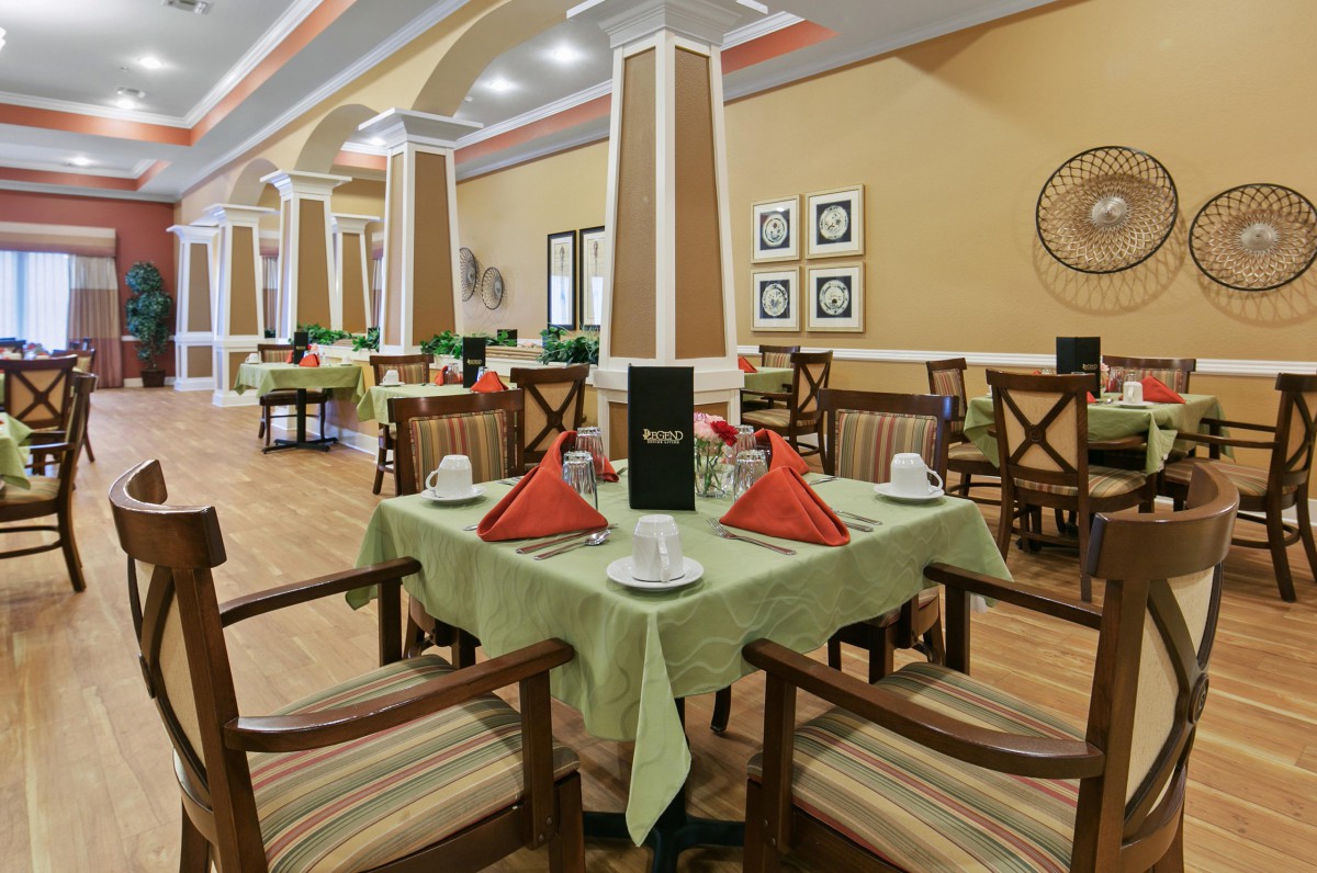 A well-decorated restaurant interior with neatly set tables and chairs.