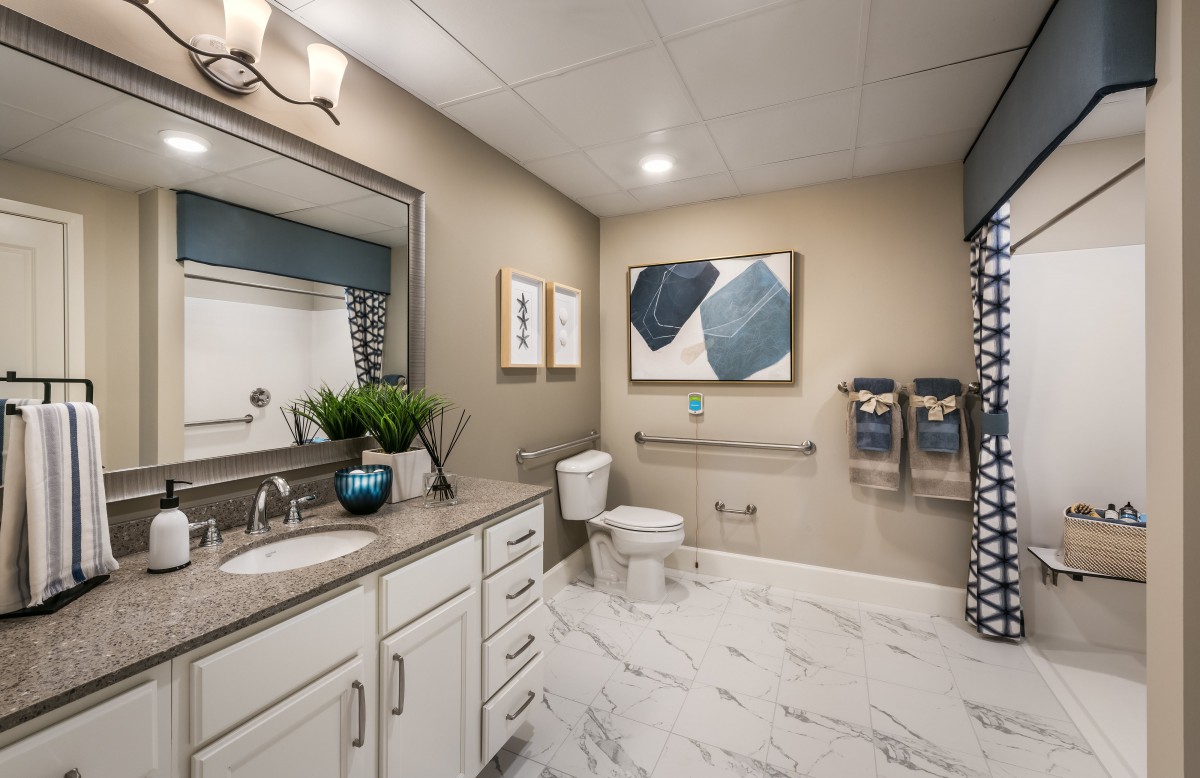 A modern bathroom with sleek decor and neutral tones.