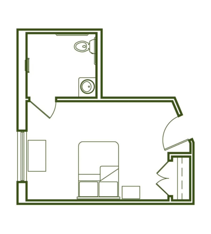 A simple studio apartment floor plan with a bathroom and living area.